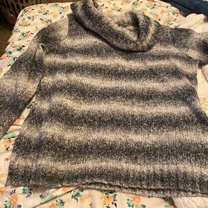 Warm mock turtleneck sweater. No tears or pulls. Well maintained.